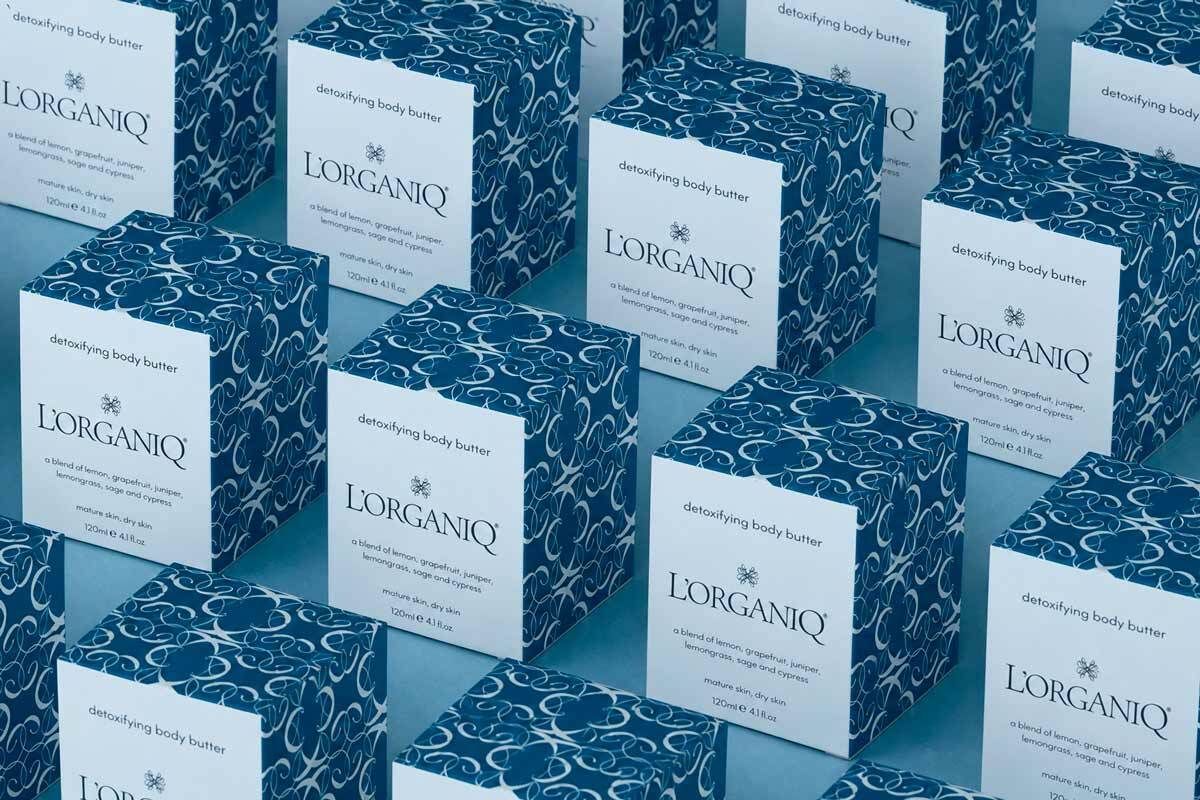 A series of boxes with white graphics and light blue details, created on Packly by Emma of the L’Organiq brand