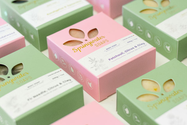 Pink and sage-green soap boxes